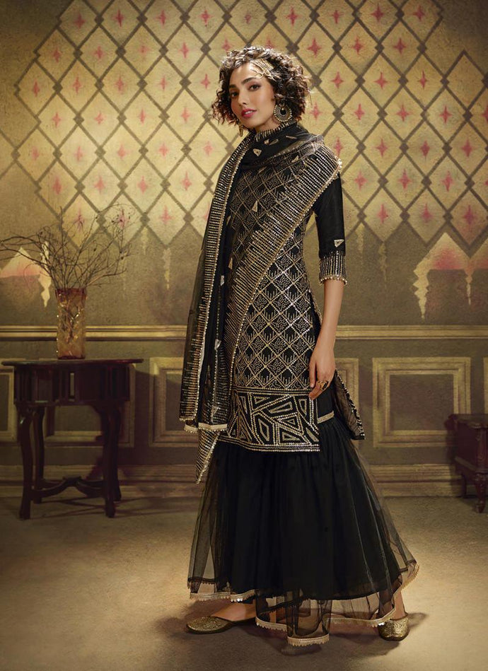 Eye-catching Black Soft Net And Sequence Sharara Salwar Suit.