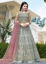 Load image into Gallery viewer, grey colored heavy work with contrast dupatta soft net base slit cut suit
