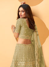 Load image into Gallery viewer, buy Pista Green Color Soft Net Base Stone And Zari Work Lehenga
