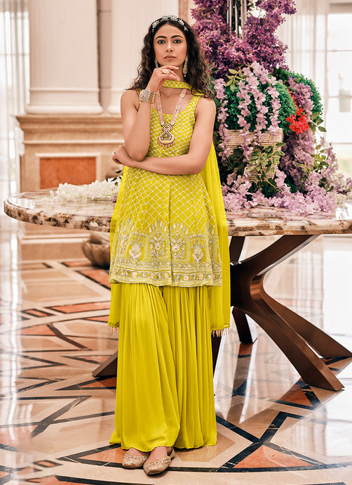 Sleeveless Frock Style Top Yellow Color Embroidered Sharara Suit