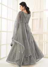 Load image into Gallery viewer, shop staggering Zari worked steel grey colored soft net base designer gown
