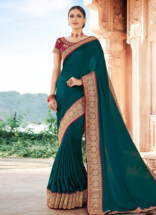 traditional wear pine green colored silk weave base saree