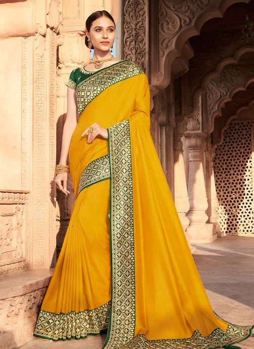 traditional wear yellow colored silk weave designer saree