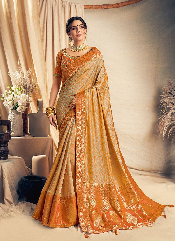 Auspicious orange silk base saree with designer blouse