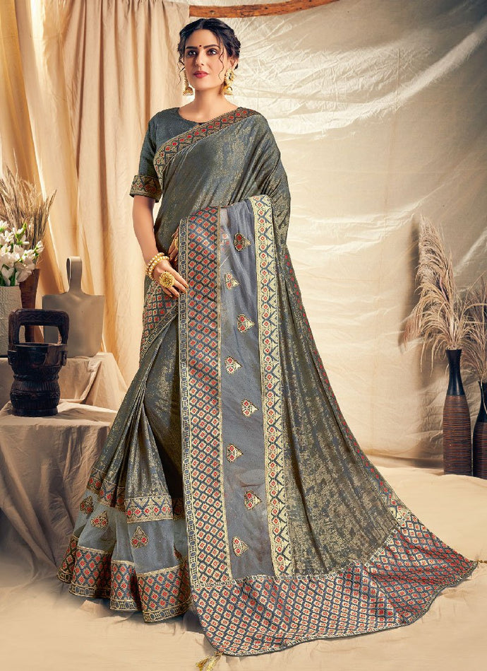 Glorious grey colored embroidered silk base saree