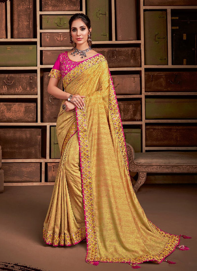 Eye-catching yellow and pink colored silk base saree