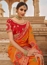 Load image into Gallery viewer, Online ravishing orange color wedding wear silk weave saree
