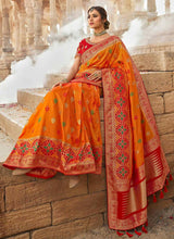 Load image into Gallery viewer, ravishing orange color wedding wear silk weave saree
