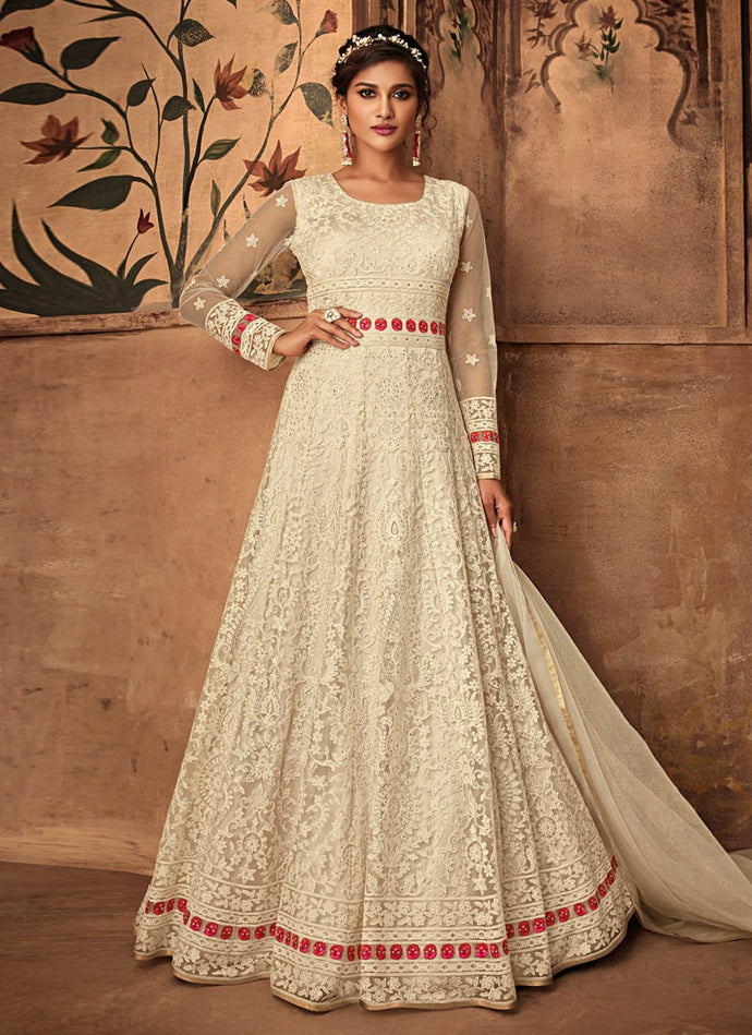 designer partywear cream colored stone worked soft net base gown