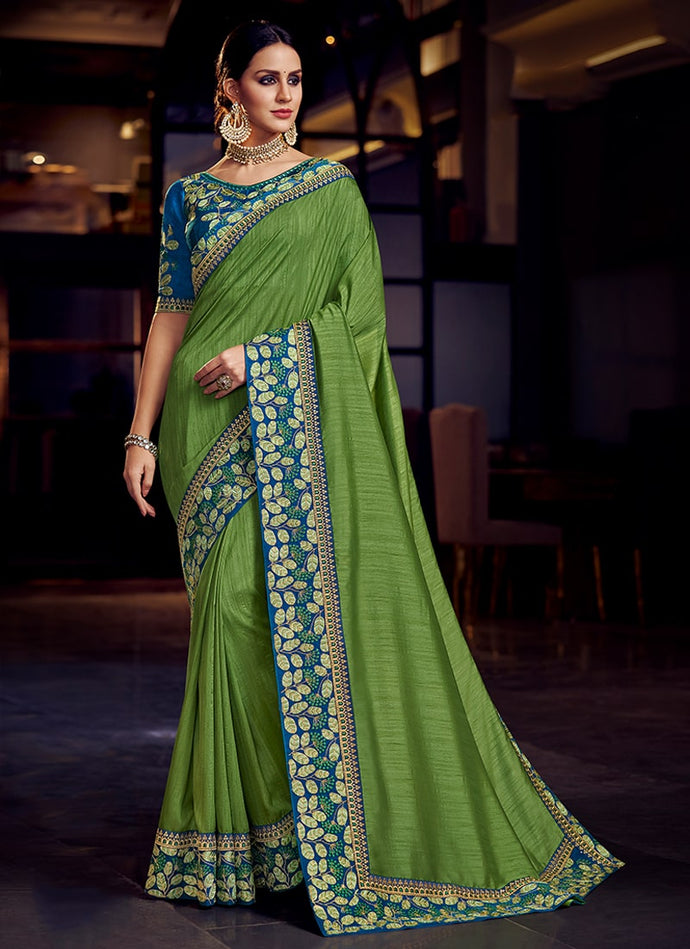 Emerald green colored silk base partywear sareeEmerald parrot green colored silk base saree