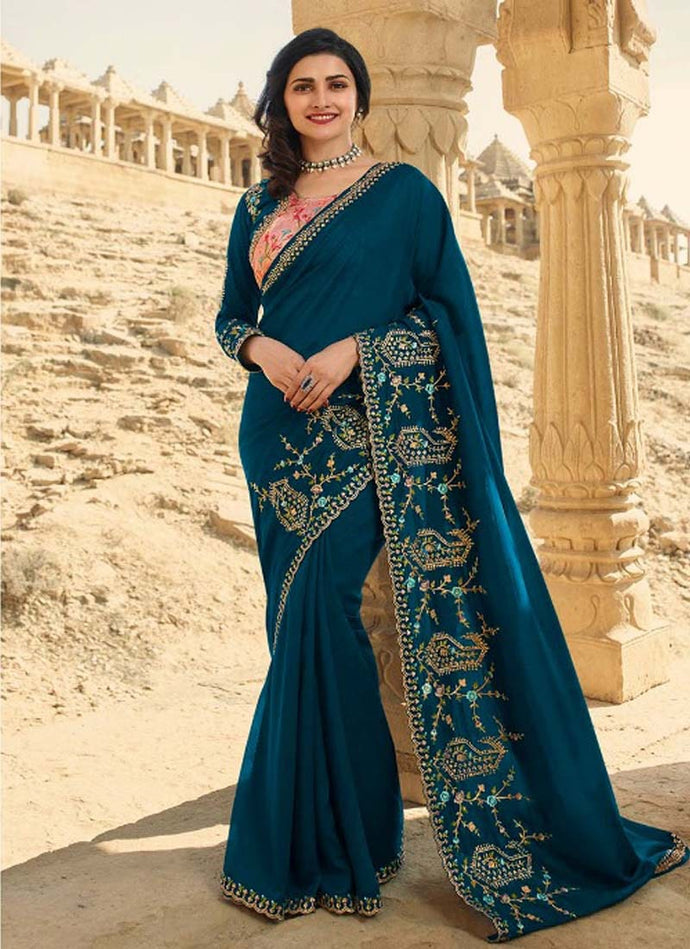 trendy turquoise blue colored silk base designer saree