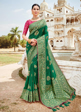 Load image into Gallery viewer, trendy hunter green colored silk weave wedding wear saree
