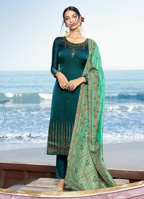 Teal green colored Swarovski worked pant style suit with silk dupatta