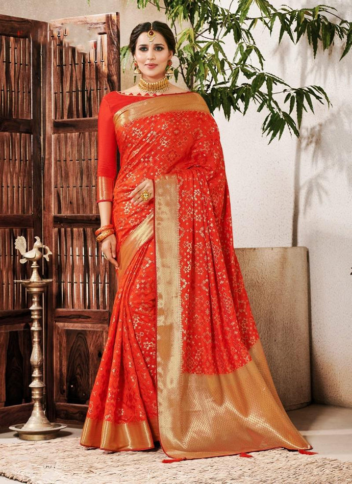 delightful wedding wear orange colored silk weave saree