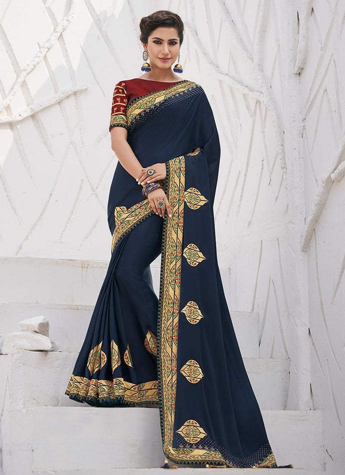 Chic navy blue colored partywear silk weave saree