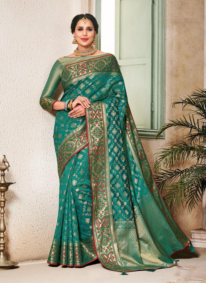 magical wedding wear green colored silk weave saree