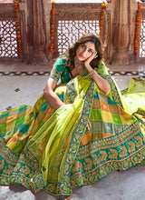Load image into Gallery viewer, Online stunning traditional wear embroidered green colored silk base lehenga choli
