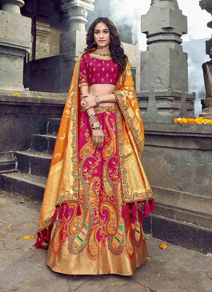 spectacular silk base embroidered pink and gold colored lehenga choli