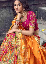 Load image into Gallery viewer, Buy spectacular silk base embroidered pink and gold colored lehenga choli
