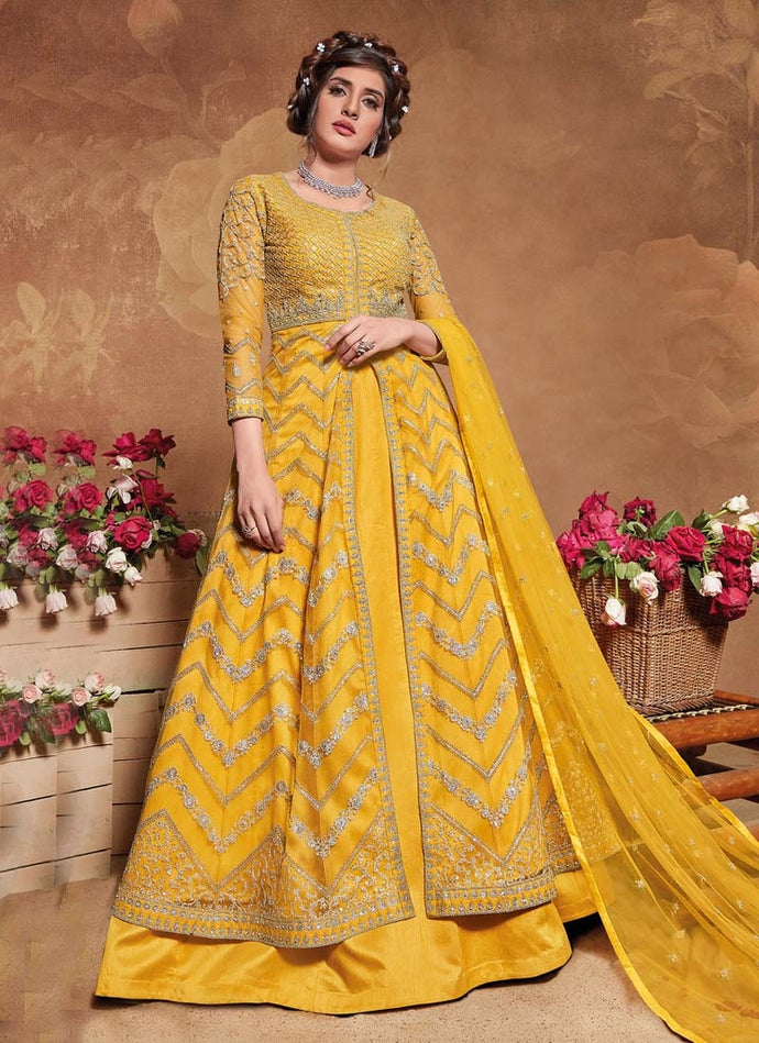 youthful yellow colored heavy work embroidered gown