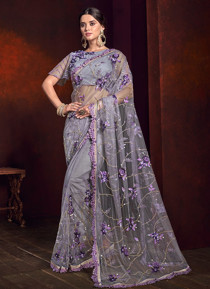 festive purple colored partywear soft net base saree