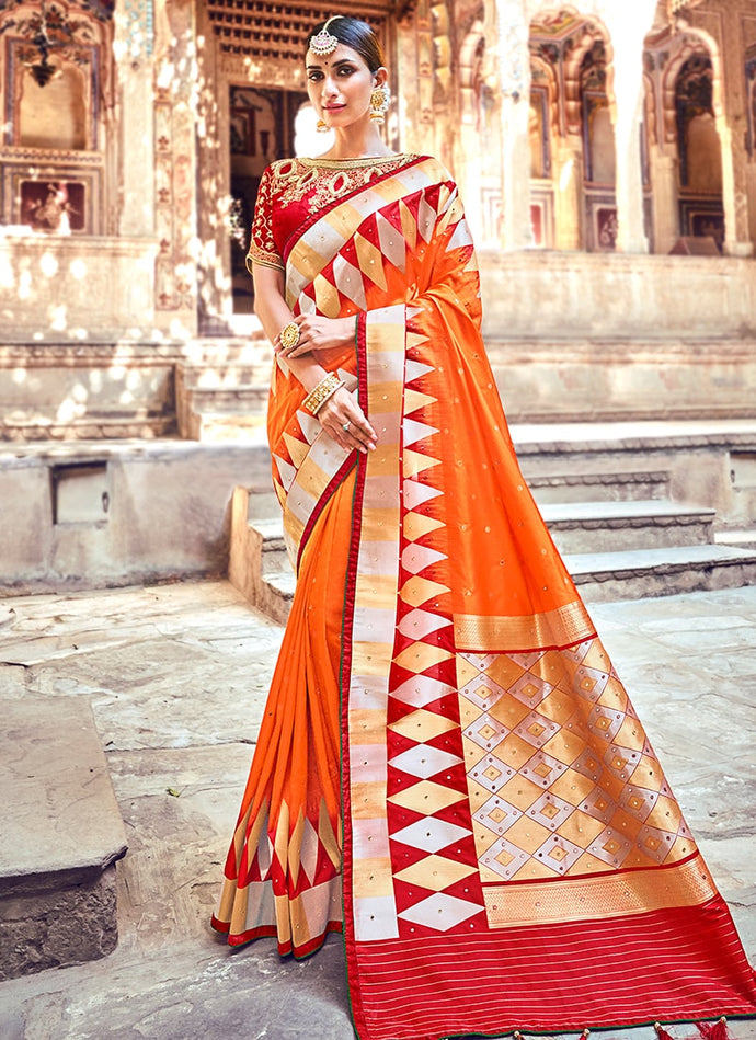 orange colored silk base with designer blouse banarasi  saree