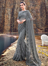 Load image into Gallery viewer, glowing grey colored stone worked soft net base saree
