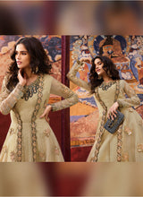 Load image into Gallery viewer, buy Royal beige colored heavy Zari worked jacket style designer gown
