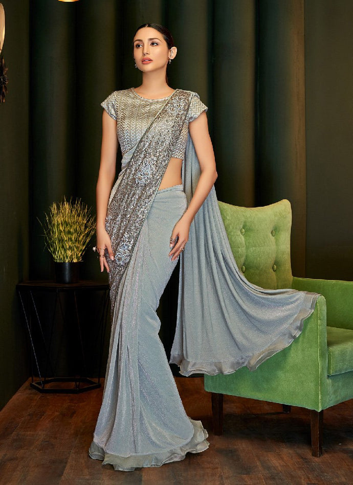 Heavily embellished grey colored partywear silk base saree