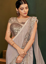 Load image into Gallery viewer, buy Glitzy beige colored partywear silk base designer saree
