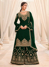 Load image into Gallery viewer, trendy forest green colored partywear heavy work palazzo suit
