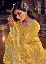 Load image into Gallery viewer, buy yellow colored stone and Zari worked festive wear pant style suit
