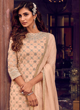 Load image into Gallery viewer, Shop cream colored stone and Zari worked festive wear sharara suit
