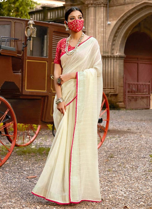 Cream colored sequins worked partywear half and half plain saree