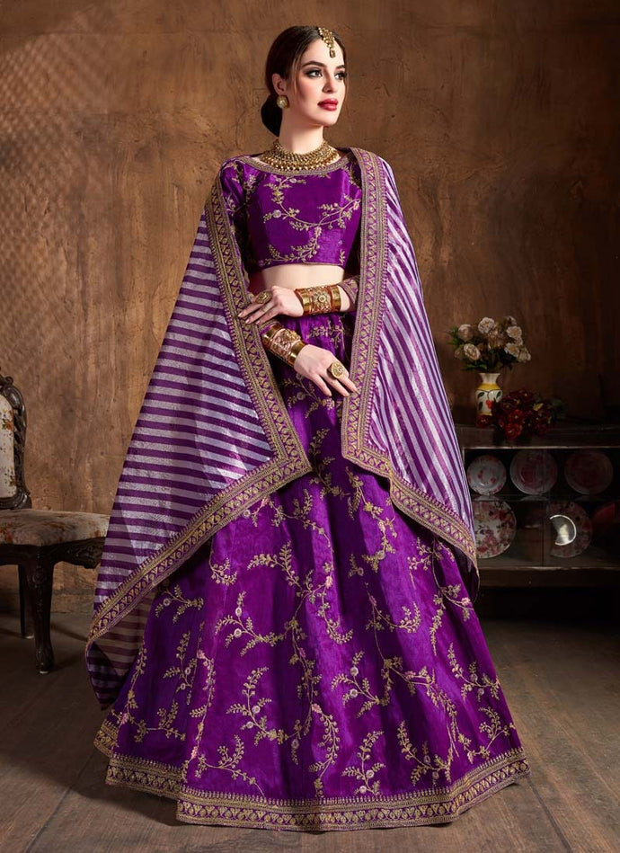 purple colored embroidered lehenga choli with lace bordered dupatta