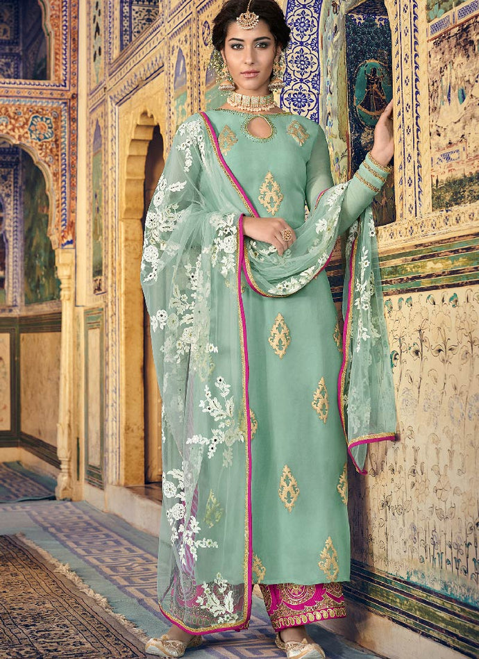 Sea green colored heavily embroidered straight suit