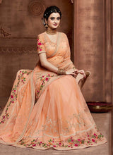 Load image into Gallery viewer, buy Amusing coral peach colored embroidered soft net base partywear saree
