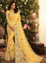Load image into Gallery viewer, buy lemon yellow colored partywear heavy work soft net base saree
