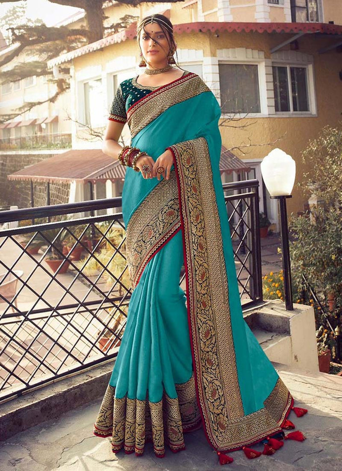 aqua green colored weddingwear silk base saree with designer blouse