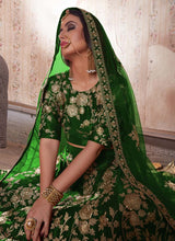 Load image into Gallery viewer, shop green stylish weddingwear heavy work embroidery velvet base lehenga choli
